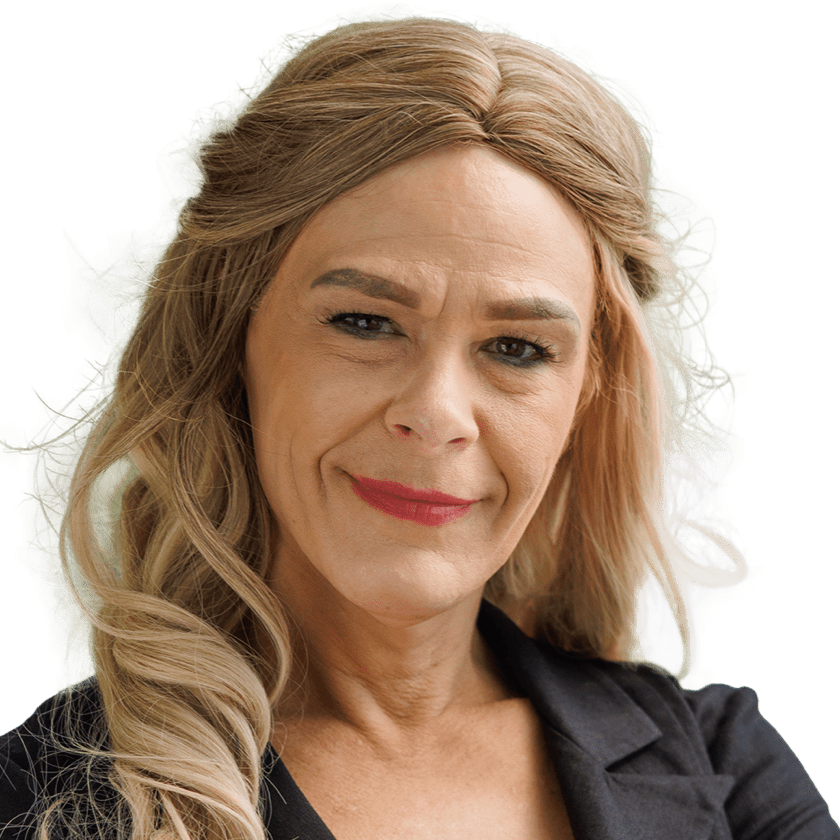 A white woman with long blonde hair faces the camera with a neutral smile