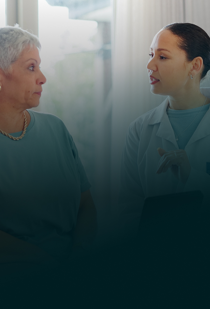 A senior woman having a conversation with her doctor.