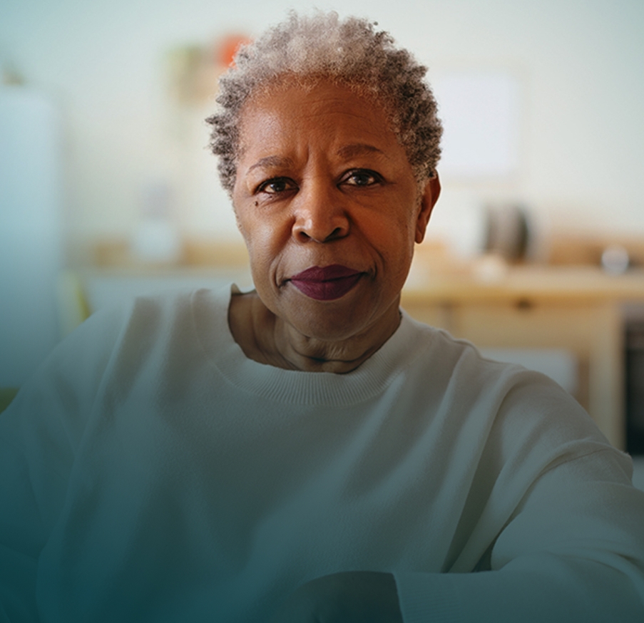 Actor portrayal of an older African American woman facing the camera with a neutral expression.