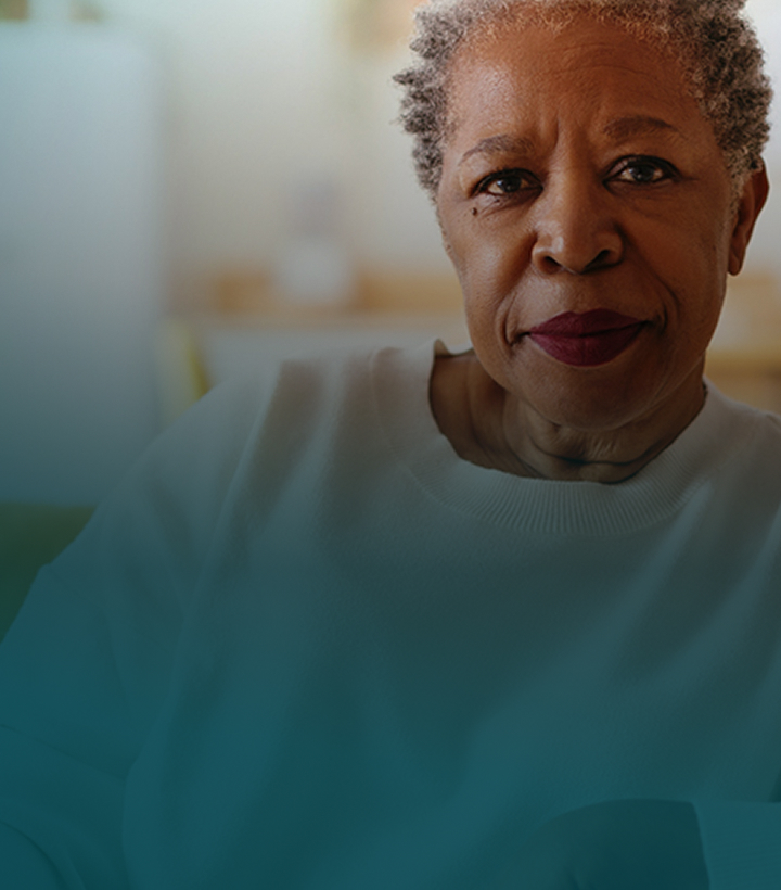 Actor portrayal of an older African American woman facing the camera with a neutral expression.